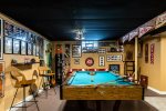Basement hang out space has a pool table and is perfect for kids 